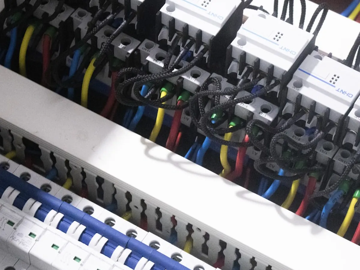 Electrician working on a commercial distribution board